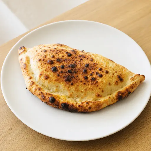 Calzone Bella Casa, Schinken, frische Tomaten, Broccoli, Champignons, Sauce Hollandaise - Bella Casa Datteln